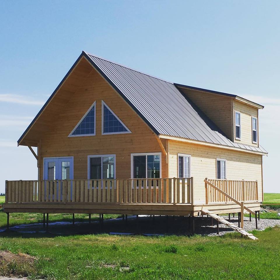 a wooden cabin on screw piles