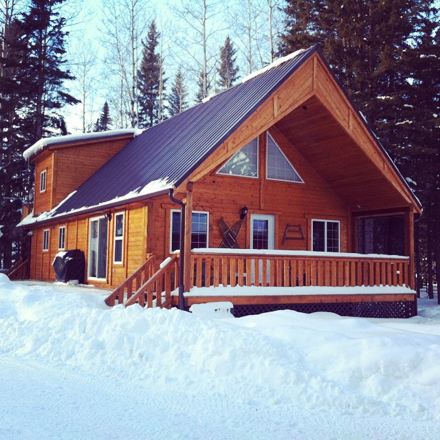 a wooden house in a showy weather